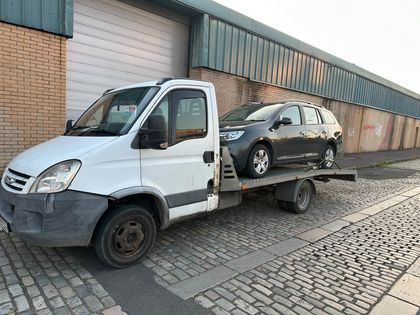 Loading on a cobbled lane beside an old warehouse — Roadsist Auto, North Lanarkshire