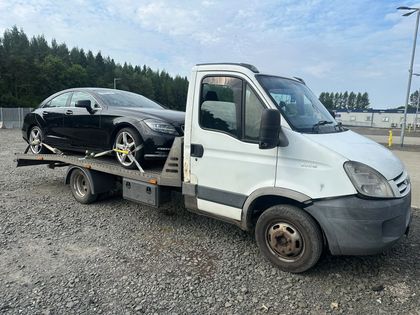 A car wheel-strapped to a Roadsist Auto flatbed, ready for a scheduled run out of the UK